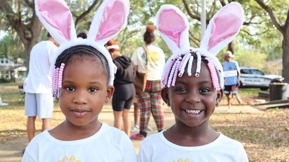 Two girls wearing bunny ears at the Spring Family Picnic event at Jordan Park on March 26, 2024.