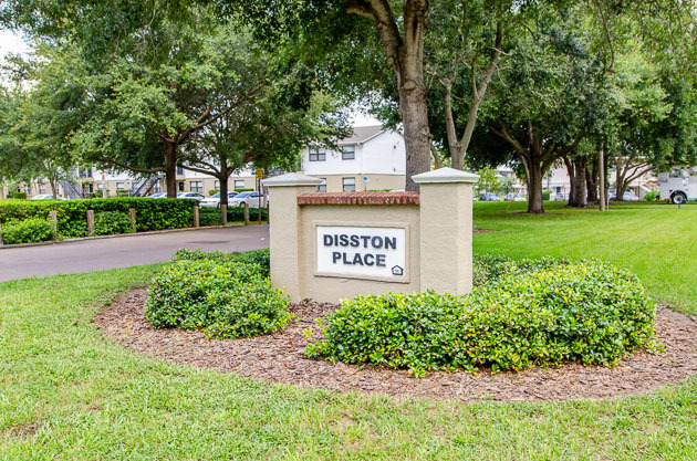 Disston Place Apartments sign.