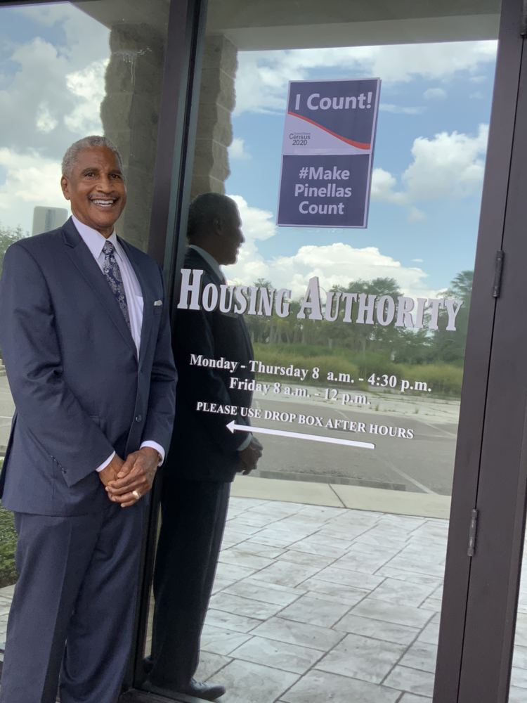 Pictured is SPHA CEO Mr. Michael Lundy at the front door of the SPHA Office by the “I Count! #Make Pinellas Count” 2020 Census poster.