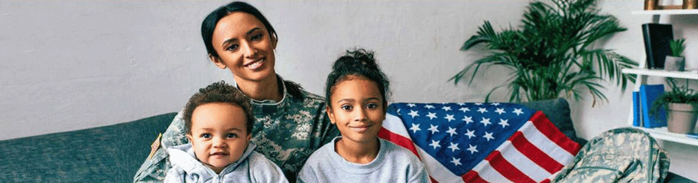 Veteran mom and her children sitting on couch.