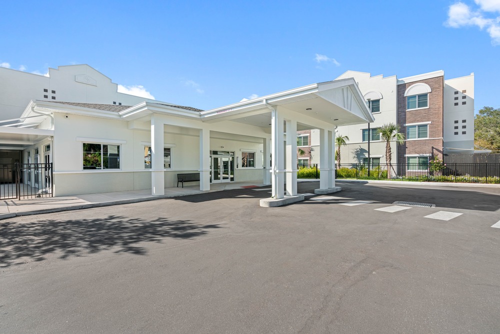 Portico of The Legacy at Jordan Park senior midrise building.