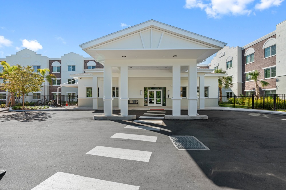 Outside entrance of The Legacy at Jordan Park senior midrise building.