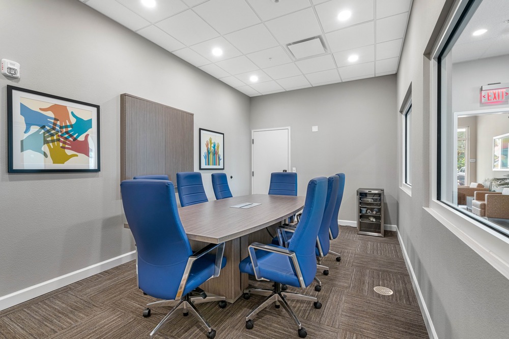 Meeting room inside The Legacy at Jordan Park senior midrise building.