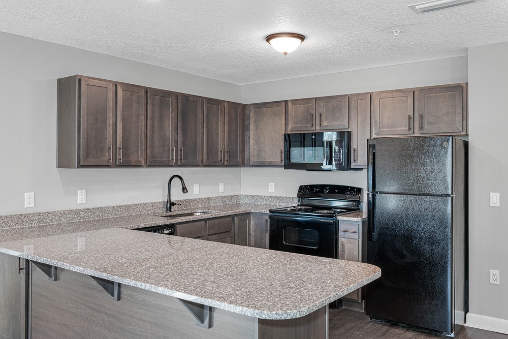 Unit kitchen inside The Legacy at Jordan Park senior midrise building.