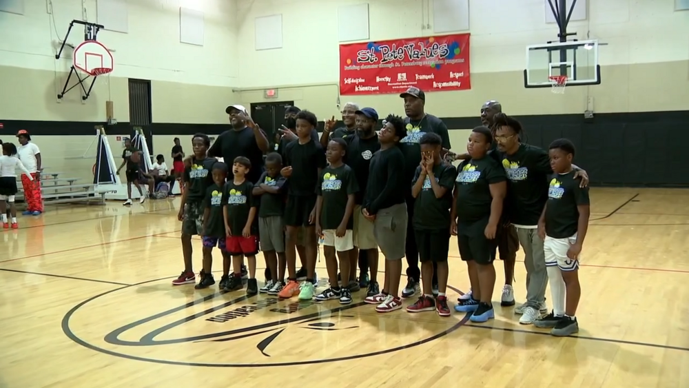 Group of kids on basketball court.