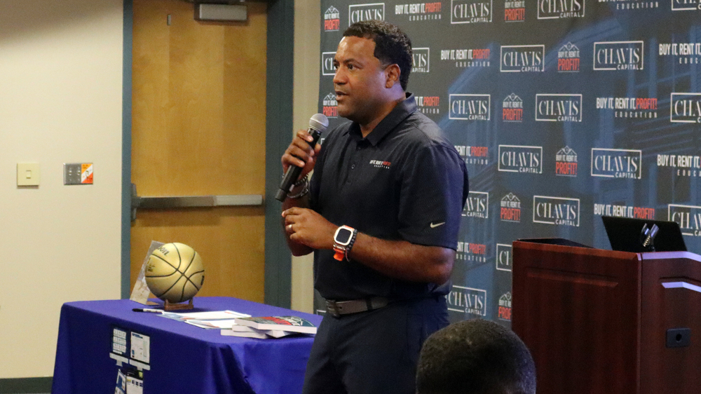 Bryan Chavis speaking with microphone.