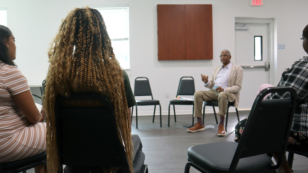 St. Petersburg Housing Authority (SPHA) President and CEO Michael Lundy speaking with Jordan Park residents.