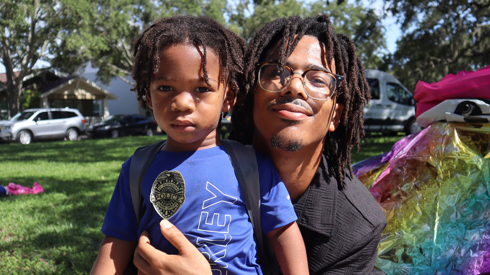 Dad and son at Back to School event in Jordan Park.