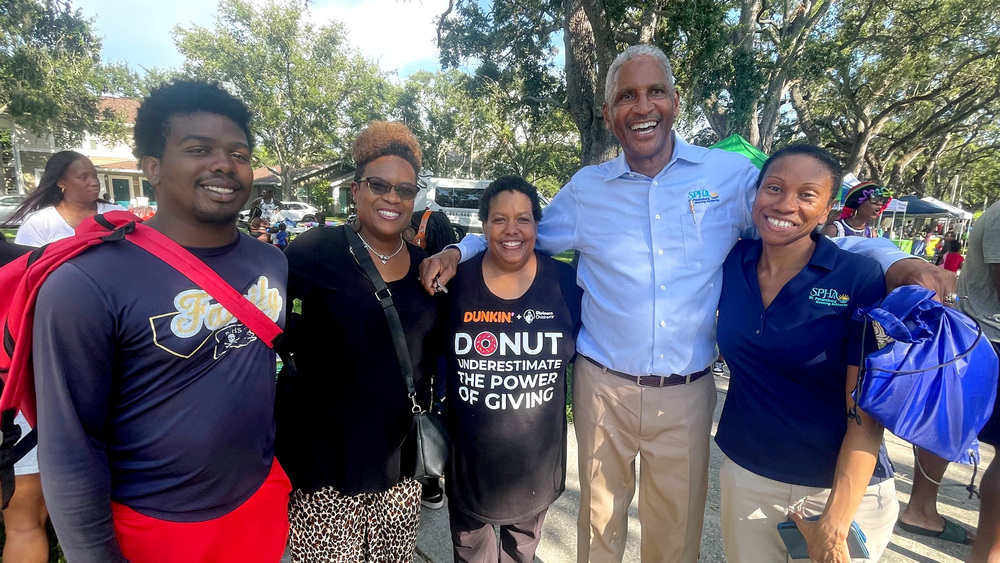 Group of people at SPHA Back to School event in Jordan Park.