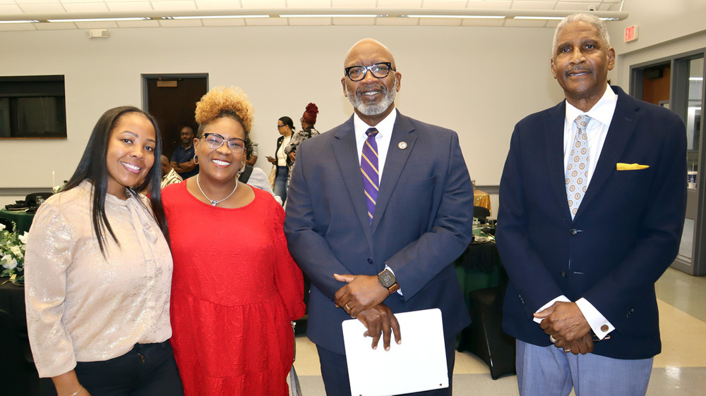 Four people at the 2025 FSS award event.