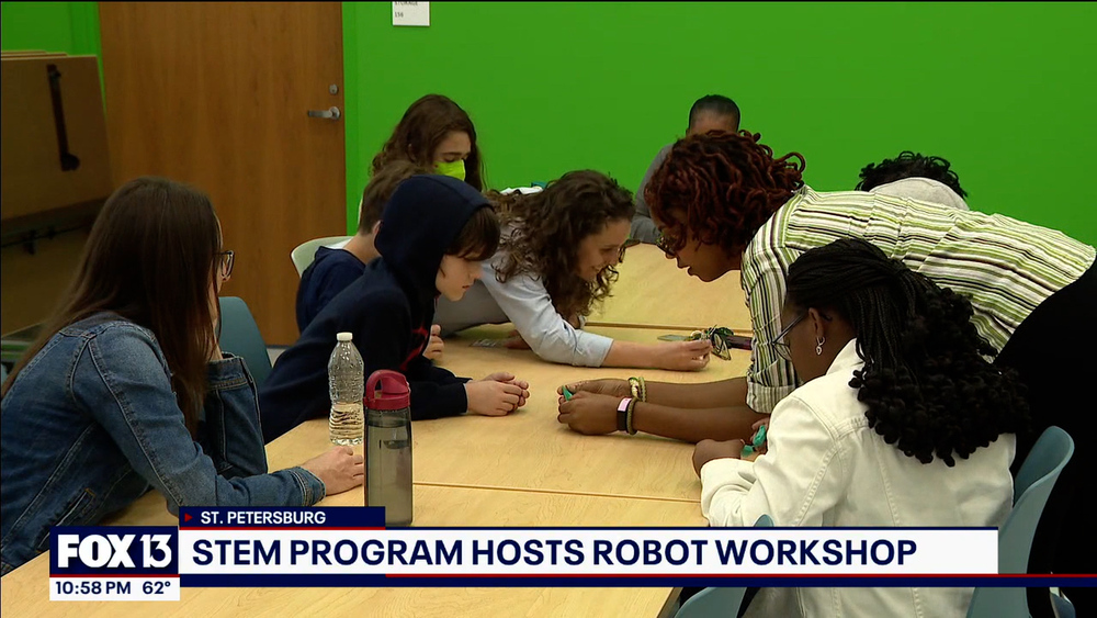 Youth participating in robotics workshop.