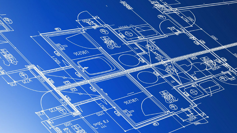 Blue architectural blueprints of a house.