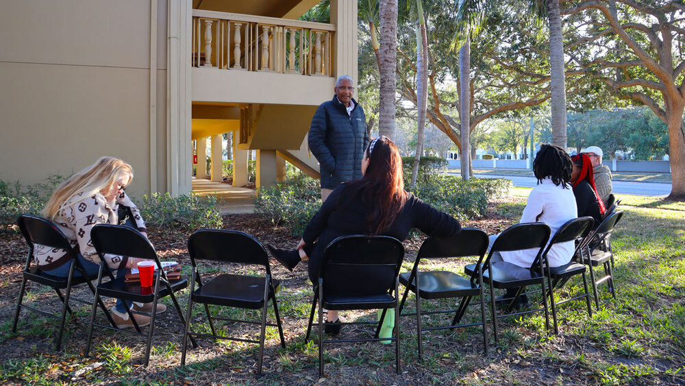 St. Petersburg Housing Authority (SPHA) hosting a Snack & Chat event outside Romayne Apartments.