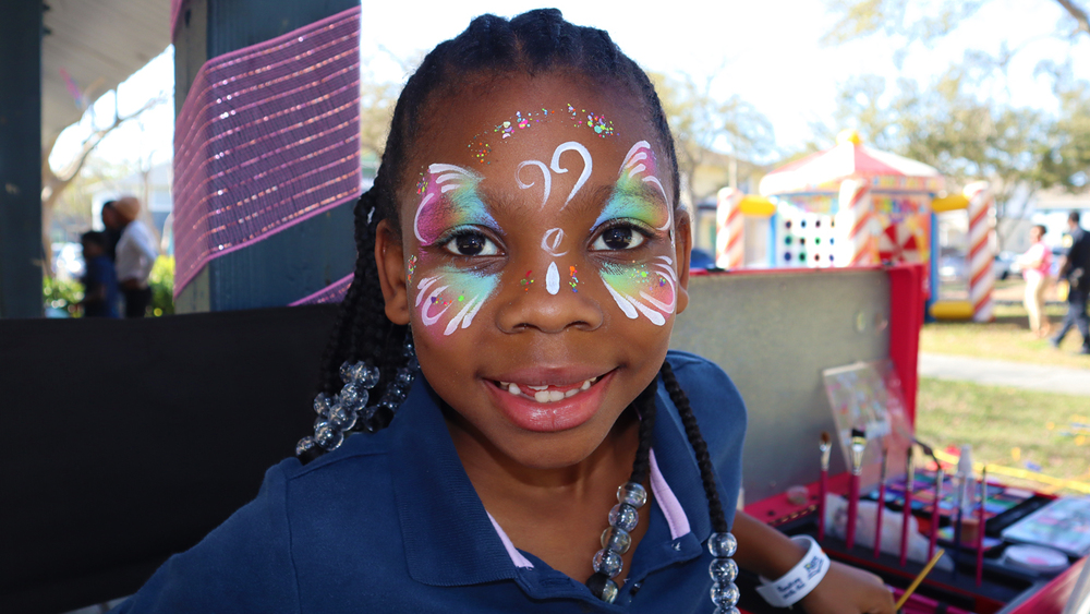 Child enjoying activities at the SPHA Spring Family Picnic in Jordan Park.