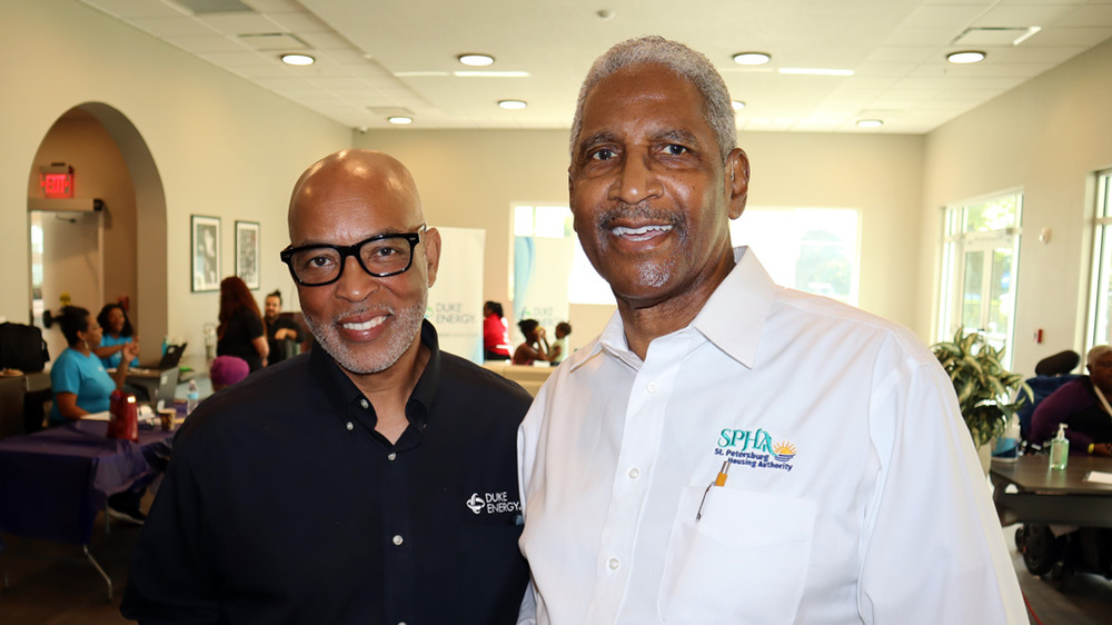 Duke Energy representative with Michael Lundy, President & CEO of the St. Peterburg Housing Authority.