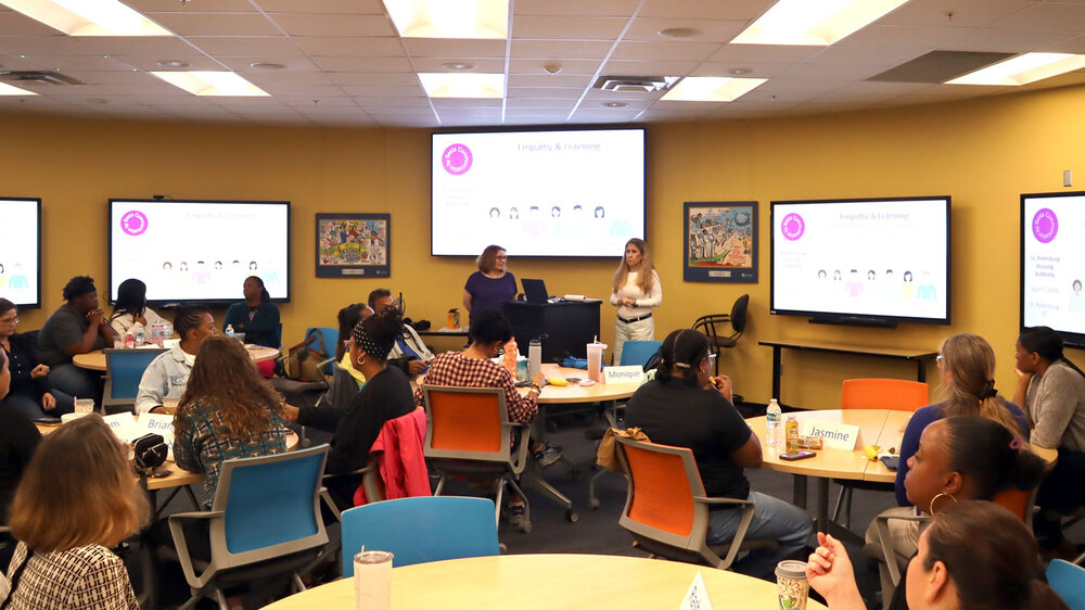 The St. Petersburg Housing Authority (SPHA) team engaging in customer service training.