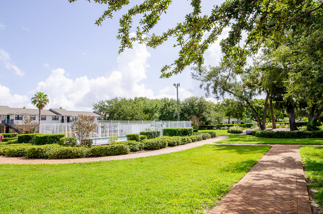 Disston Place Apartments exterior with pool.