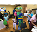 Wyatt Beanstalk from Super Why interacting with a group of children.