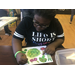 Girl drawing vegetables.