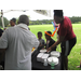 Kids getting paper plates in food line.