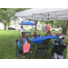 Guests at fold table with blue tablecloth.