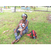 Woman sitting on grass with little boy in Crescent Lake Park.