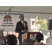 SPHA President and CEO Michael Lundy at podium in Jordan Park.
