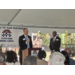 Brian Evjen at podium in Jordan Park.