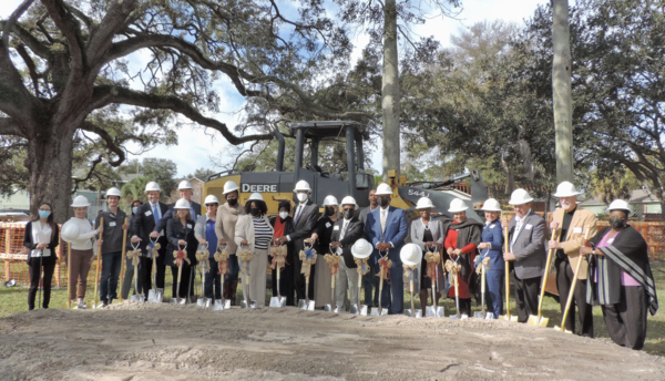 Group of people with shovels and hardhats.