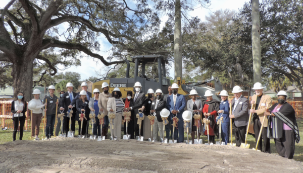 Group of people with shovels and hardhats 