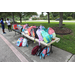 Backpacks and snacks on table with green grass and trees in the background at Gateway Place Apartments.