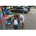SPHA President and CEO Michael Lundy with a young child wearing backpack at Gateway Place Apartments.