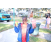 A young boy holding a frozen treat and popcorn at Very Merry Holiday Party at Jordan Park.