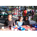 Three children seated at table at Very Merry Holiday Party at Jordan Park.
