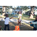Three children playing with bubbles at Very Merry Holiday Party at Jordan Park.
