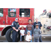 St. Petersburg Fire Rescue’s truck and a family at Very Merry Holiday Party at Jordan Park 2022.