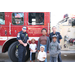 St. Petersburg Fire Rescue truck and a family at Very Merry Holiday Party at Jordan Park.