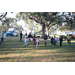 Children playing in grass area at Very Merry Holiday Party at Jordan Park 2022.
