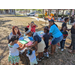 Families smiling and playing at Jordan Park Easter Egg Hunt.