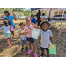 Kids smiling at Jordan Park Easter Egg Hunt.