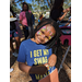 Child smiling with face painted.