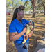 Woman holding a baby at Jordan Park Easter Egg Hunt.