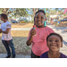 Children smiling at Jordan Park Easter Egg Hunt.