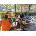 Families sitting at table at Jordan Park Easter Egg Hunt.