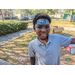 Child smiling with blue face paint at Jordan Park Easter Egg Hunt.