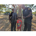 Police smiling with child at Jordan Park Easter Egg Hunt.