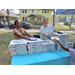 Two people at Domino's pizza table in Jordan Park.