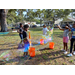 Kids playing with bubbles in Jordan Park.