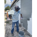 SPHA team members painting house.