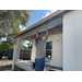 SPHA team members painting house.